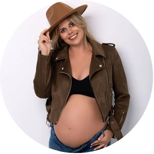 Pregnant lady during photo shoot with cowboy hat
